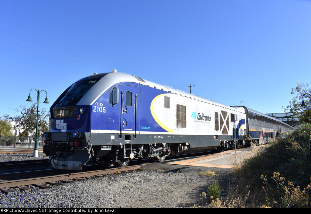 Amtrak Train # 531 leaving Martinez Station behind Caltrans Charger # 2106 